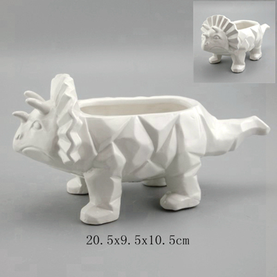white ceramic dinosaur planter