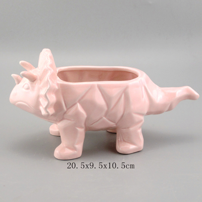 pink ceramic dinosaur planter